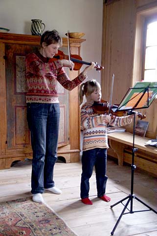 Mother and Daughter Playing Violin